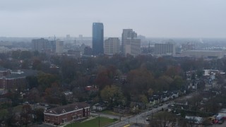 DX0001_003205 - 5.7K aerial stock footage of the city skyline seen from residential neighborhoods, Downtown Lexington, Kentucky
