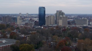 DX0001_003217 - 5.7K aerial stock footage descend and slowly pass the city's skyline in Downtown Lexington, Kentucky