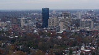 DX0001_003218 - 5.7K aerial stock footage slowly flyby the city's skyline before flying away in Downtown Lexington, Kentucky