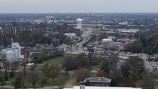 DX0001_003221 - 5.7K aerial stock footage flyby busy street in industrial area near water tower in Lexington, Kentucky