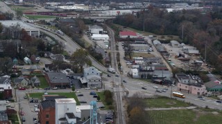 DX0001_003223 - 5.7K aerial stock footage passing a busy street and railroad tracks in industrial area in Lexington, Kentucky