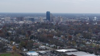 DX0001_003230 - 5.7K aerial stock footage of city skyline while flying by houses, Downtown Lexington, Kentucky