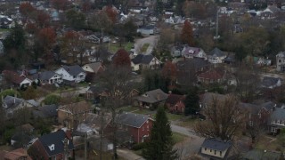 DX0001_003233 - 5.7K aerial stock footage of panning across suburban homes and quiet streets in Lexington, Kentucky