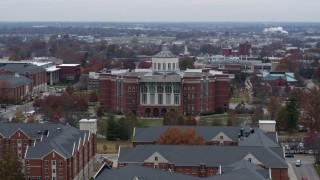 DX0001_003248 - 5.7K aerial stock footage of passing by a University of Kentucky library, Lexington, Kentucky