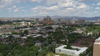 DX0001_004_045 - 5.7K aerial stock footage of a static and then moving view of hotels and casinos of the city's skyline in Reno, Nevada