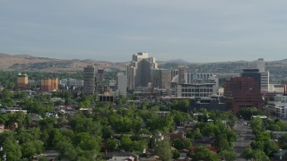 DX0001_006_014 - 5.7K aerial stock footage of casino resorts and office buildings seen from neighborhoods in Reno, Nevada