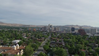 DX0001_006_019 - 5.7K aerial stock footage of casino resorts and office buildings seen from suburban neighborhood in Reno, Nevada