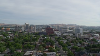 DX0001_006_023 - 5.7K aerial stock footage fly away from casino resorts and office buildings in Reno, Nevada