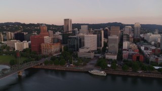 DX0001_010_007 - 4K aerial stock footage of the downtown skyline and Hawthorne Bridge at sunrise, Downtown Portland, Oregon