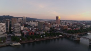 DX0001_010_008 - 4K aerial stock footage of downtown buildings, Morrison Bridge at sunrise, Downtown Portland, Oregon