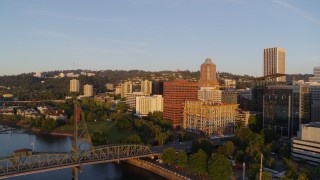 DX0001_010_020 - 4K aerial stock footage approaching Hawthorne Bridge at sunrise in Downtown Portland, Oregon