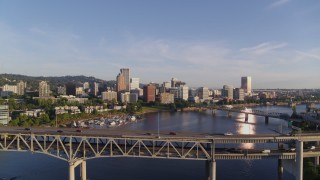 DX0001_010_032 - 4K aerial stock footage flying over Marquam Bridge, approaching Riverplace Marina and Downtown Portland, Oregon