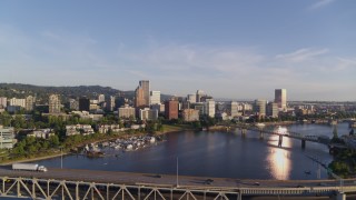 DX0001_010_033 - 4K aerial stock footage flying away from Riverplace Marina and over Marquam Bridge, Downtown Portland, Oregon