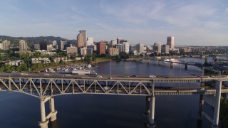 DX0001_010_038 - 4K aerial stock footage approaching and flying over the Marquam Bridge, I-5, Downtown Portland, Oregon