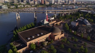 DX0001_010_043 - 5.7K aerial stock footage flying away from OSMI, Marquam Bridge and Willamette River, Southeast Portland, Oregon
