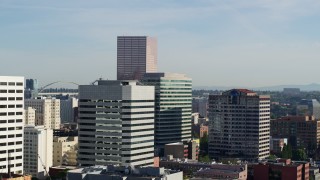 DX0001_011_003 - 5.7K aerial stock footage of the U.S. Bancorp Tower, descending behind buildings, Downtown Portland, Oregon