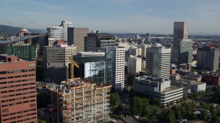 DX0001_011_006 - 5.7K aerial stock footage approaching skyscrapers and an office building under construction, Downtown Portland, Oregon