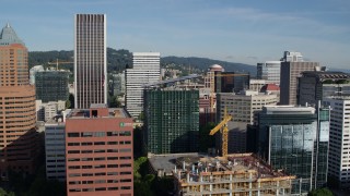 DX0001_011_014 - 5.7K aerial stock footage flying closely by office buildings and skyscrapers, Downtown Portland, Oregon