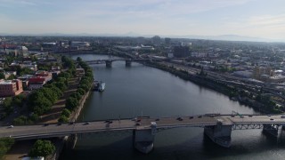 DX0001_011_021 - 5.7K aerial stock footage stationary shot of Morrison Bridge with light traffic spanning the Willamette, Downtown Portland, Oregon