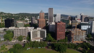 DX0001_011_024 - 5.7K aerial stock footage flying away from downtown buildings and the waterfront park in Downtown Portland, Oregon
