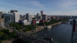 DX0001_011_033 - 5.7K aerial stock footage flyby waterfront office buildings and over Hawthorne Bridge, Downtown Portland, Oregon