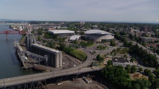 DX0001_012_007 - 5.7K aerial stock footage near Steel Bridge approaching Moda Center and Veterans Memorial Coliseum, Northeast Portland, Oregon