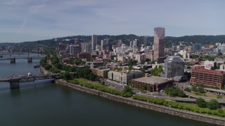 DX0001_012_011 - 5.7K stock footage aerial video fly over Willamette River, to approach Downtown Portland, Oregon