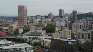 DX0001_013_014 - 5.7K aerial stock footage of skyscrapers and condo complexes at sunset in Downtown Portland, Oregon