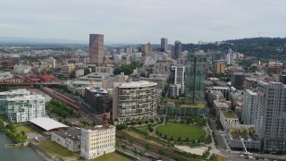 DX0001_013_026 - 5.7K aerial stock footage of downtown seen from Pearl District condominiums and a park, Downtown Portland, Oregon