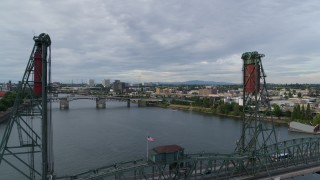 DX0001_014_001 - 5.7K aerial stock footage flying over the Hawthorne Bridge and Willamette River, sunset, Southeast Portland, Oregon