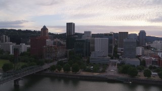 DX0001_014_023 - 5.7K aerial stock footage of Downtown Portland skyline seen from Willamette River at twilight, Oregon