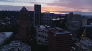 DX0001_014_039 - 5.7K aerial stock footage of a reverse view of Downtown Portland, Oregon skyscrapers at twilight