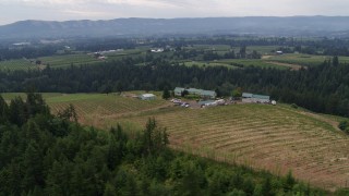 DX0001_015_005 - 5.7K aerial stock footage orbit of a winery and vineyard, Hood River, Oregon