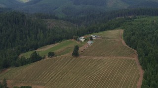 DX0001_015_032 - 5.7K aerial stock footage of a hilltop winery surrounded by forests, Hood River, Oregon