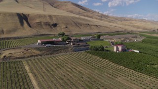 DX0001_018_005 - 5.7K aerial stock footage of an orbit of the Maryhill Winery and vineyards in Goldendale, Washington