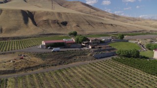 DX0001_018_008 - 5.7K aerial stock footage of passing by the Maryhill Winery, amphitheater, and vineyards in Goldendale, Washington