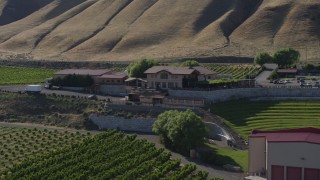 DX0001_018_038 - 5.7K aerial stock footage of passing the Maryhill Winery and amphitheater in Goldendale, Washington