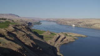 DX0001_019_005 - 5.7K aerial stock footage flyby the Columbia River to reveal Maryhill Winery and vineyard in Goldendale, Washington