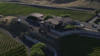 DX0001_019_015 - 5.7K aerial stock footage of a reverse view of the Maryhill Winery and reveal amphitheater in Goldendale, Washington