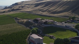 DX0001_019_018 - 5.7K aerial stock footage fly over amphitheater to orbit Maryhill Winery main building in Goldendale, Washington