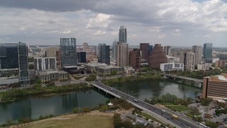 DX0002_102_007 - 5.7K aerial stock footage of the city skyline seen from across Lady Bird Lake, Downtown Austin, Texas