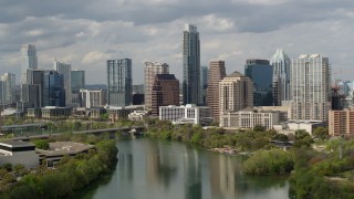 DX0002_103_007 - 5.7K aerial stock footage of towering skyscrapers in Downtown Austin, Texas seen while ascending over Lady Bird Lake