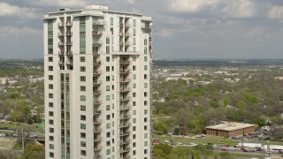 DX0002_103_010 - 5.7K aerial stock footage approach and flyby a high-rise apartment building in Downtown Austin, Texas