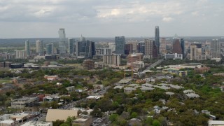 DX0002_103_018 - 5.7K aerial stock footage of a reverse view of the city's skyline in Downtown Austin, Texas