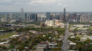 DX0002_103_024 - 5.7K aerial stock footage slow pass and reverse view of Congress Avenue leading to city's skyline in Downtown Austin, Texas