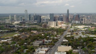 DX0002_103_025 - 5.7K aerial stock footage slow pass by Congress Avenue leading to city's skyline in Downtown Austin, Texas