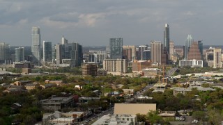 DX0002_103_029 - 5.7K aerial stock footage reverse view of the city's skyline in Downtown Austin, Texas, flyby Congress Avenue