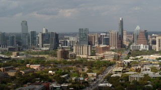 DX0002_103_031 - 5.7K aerial stock footage of traffic on Congress Avenue leading to the city's skyline, Downtown Austin, Texas