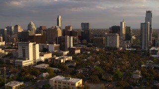 DX0002_105_008 - 5.7K aerial stock footage of office buildings and skyscrapers, flyby courthouse at sunset in Downtown Austin, Texas