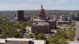 DX0002_107_006 - 5.7K aerial stock footage of orbiting around Texas State Capitol and grounds in Downtown Austin, Texas